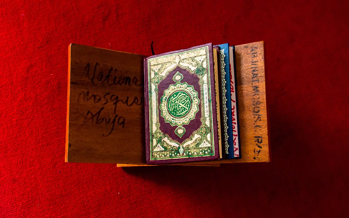 Online Quran classes in Luton – the Holy Quran open on a wooden rahl stand